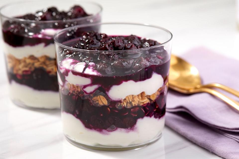 blueberry compote on top of granola and yogurt parfait