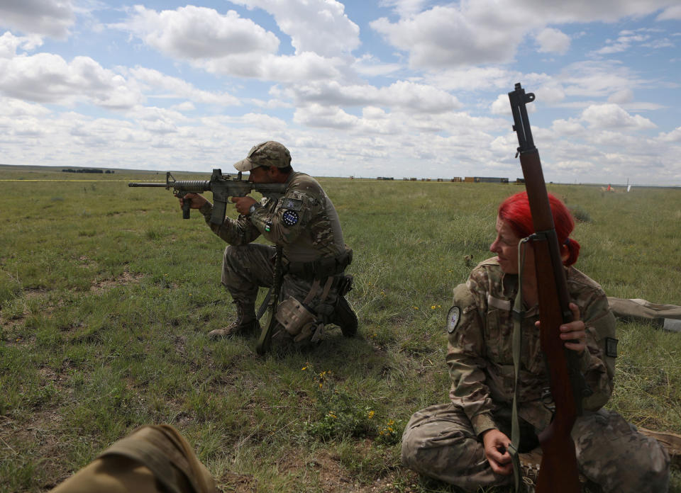 <p>Members of self-described patriot groups and militias run through shooting drills during III% United Patriots’ Field Training Exercise outside Fountain, Colo., July 29, 2017. (Photo: Jim Urquhart/Reuters) </p>