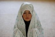 Female soldier Mohazama Najebi, 18, from the Afghan National Army (ANA), prays inside a mosque at the Kabul Military Training Centre (KMTC) in Kabul, Afghanistan, October 26, 2016. REUTERS/Mohammad Ismail