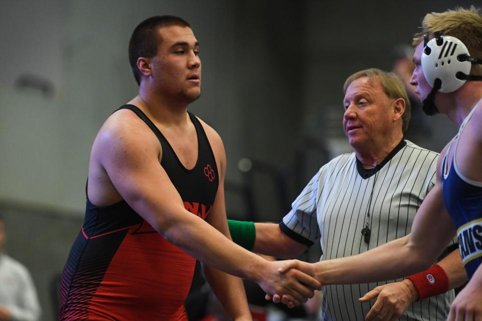 Brandon Valley’s Navarro Schunke shakes hands with West Central’s Gavin Pischke after a match on Saturday, Feb. 10, 2024 at Dacotah Bank Center in Brookings.