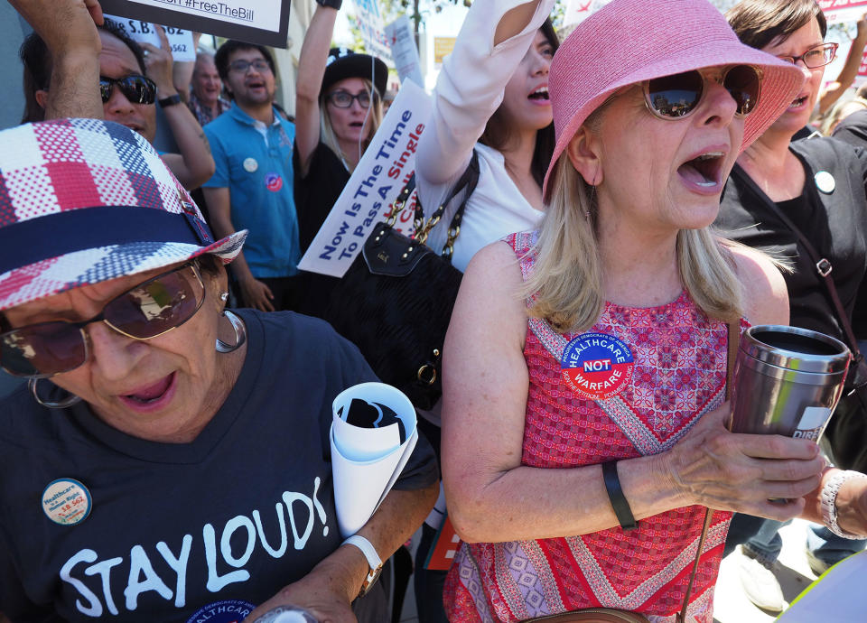 <p>People rally in favor of single-payer healthcare for all Californians as the U.S. Senate prepares to vote on the Senate GOP health care bill, outside the office of California Assembly Speaker Anthony Rendon, June 27, 2017 in South Gate, Calif. Rendon announced last week that Senate Bill SB 562 – the high-profile effort to establish a single-payer healthcare system in California – would be shelved, saying it was “incomplete.” (Photo: Robyn Beck/AFP/Getty Images) </p>