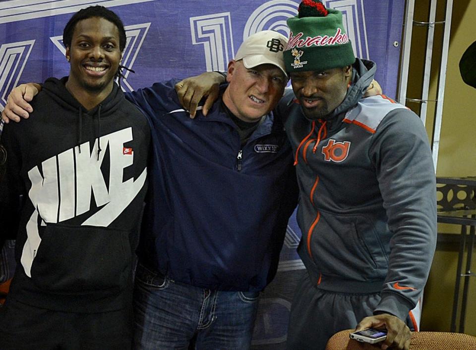 Murphy in the Morning, center, jokes around with Green Bay Packers players M.D. Jennings, left, and James Jones for a photo after WIXX-FM's "1 on 1 With the Boys" radio show in 2013.