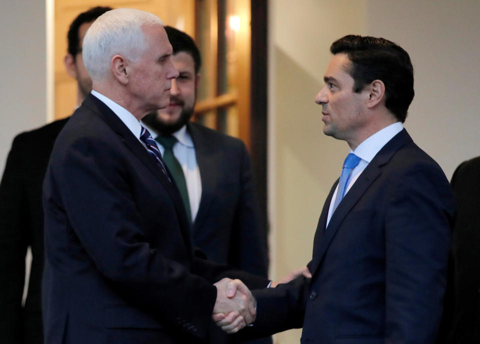 FILE PHOTO: U.S. Vice President Mike Pence (left) shakes hands with Carlos Alfredo Vecchio, charge d’affaires appointed by Venezuela's self-proclaimed interim president Juan Guaido after their meeting at the White House in Washington, U.S., January 29, 2019. REUTERS/Jim Young/File Photo