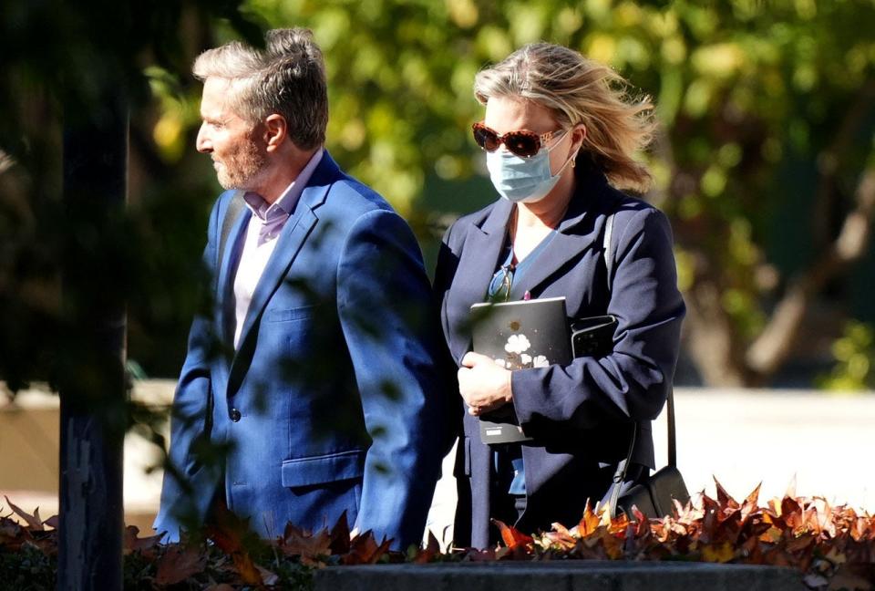 Dr. Peter Grossman walks with his wife, Rebecca Grossman, to the Van Nuys courthouse in January.