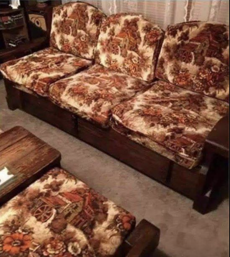 Old futon-style dark-wood couch and chairs with floral pattern