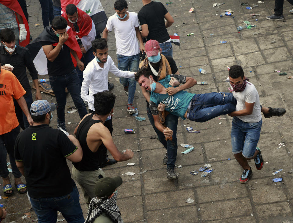 An injured protester is rushed to a hospital during a demonstration in Baghdad, Iraq, Monday, Oct. 28, 2019. (Photo: Hadi Mizban/AP)