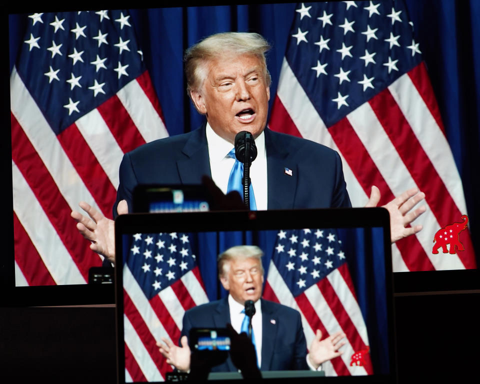 Photo taken in Arlington, Virginia, the United States, on Aug. 24, 2020 shows screens displaying U.S. President Donald Trump speaking during the 2020 Republican National Convention in Charlotte, North Carolina. (Liu Jie/Xinhua via Getty)