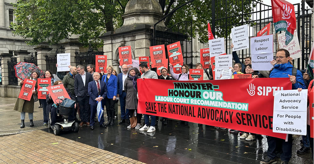 NAS workers and SIPTU union members holds a banner which reads, 