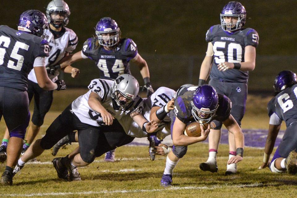 Mitchell's Ty Turbyfill (2) runs the ball during their game against Robbinsville on December 3, 2021. Mitchell defeated Robbinsville 34-21 to become the 2021 regional champions.