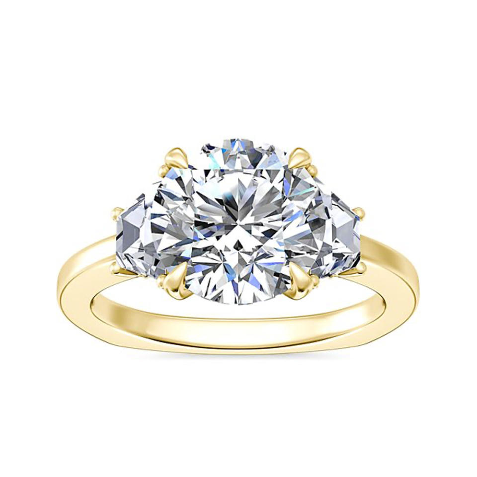 Blue Nile Bella Vaughan Trapezoid Three Stone Engagement Ring In 18k Yellow Gold on white background