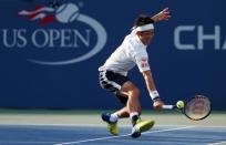 Sep 5, 2016; New York, NY, USA; Kei Nishikori of Japan hits a shot to Ivo Karlovic of Croatia on day eight of the 2016 U.S. Open tennis tournament at USTA Billie Jean King National Tennis Center. Mandatory Credit: Jerry Lai-USA TODAY Sports