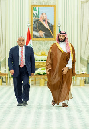 Saudi Arabia's Crown Prince Mohammed bin Salman walks with Iraq's Prime Minister Adel Abdul Mahdi in Riyadh, Saudi Arabia April 17, 2019. Picture taken April 17, 2019. Bandar Algaloud/Courtesy of Saudi Royal Court/Handout via REUTERS