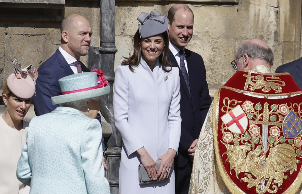 Members of Britain's Royal family watch as Britain's Queen Elizabeth II arrives to attend the Easter Mattins Service at St. George's Chapel, at Windsor Castle in England Sunday, April 21, 2019. (AP Photo/Kirsty Wigglesworth, pool)