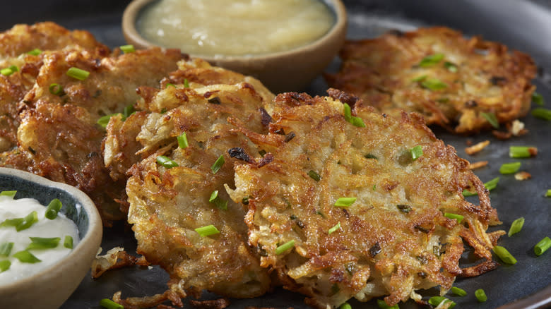 Latkes on a black plate