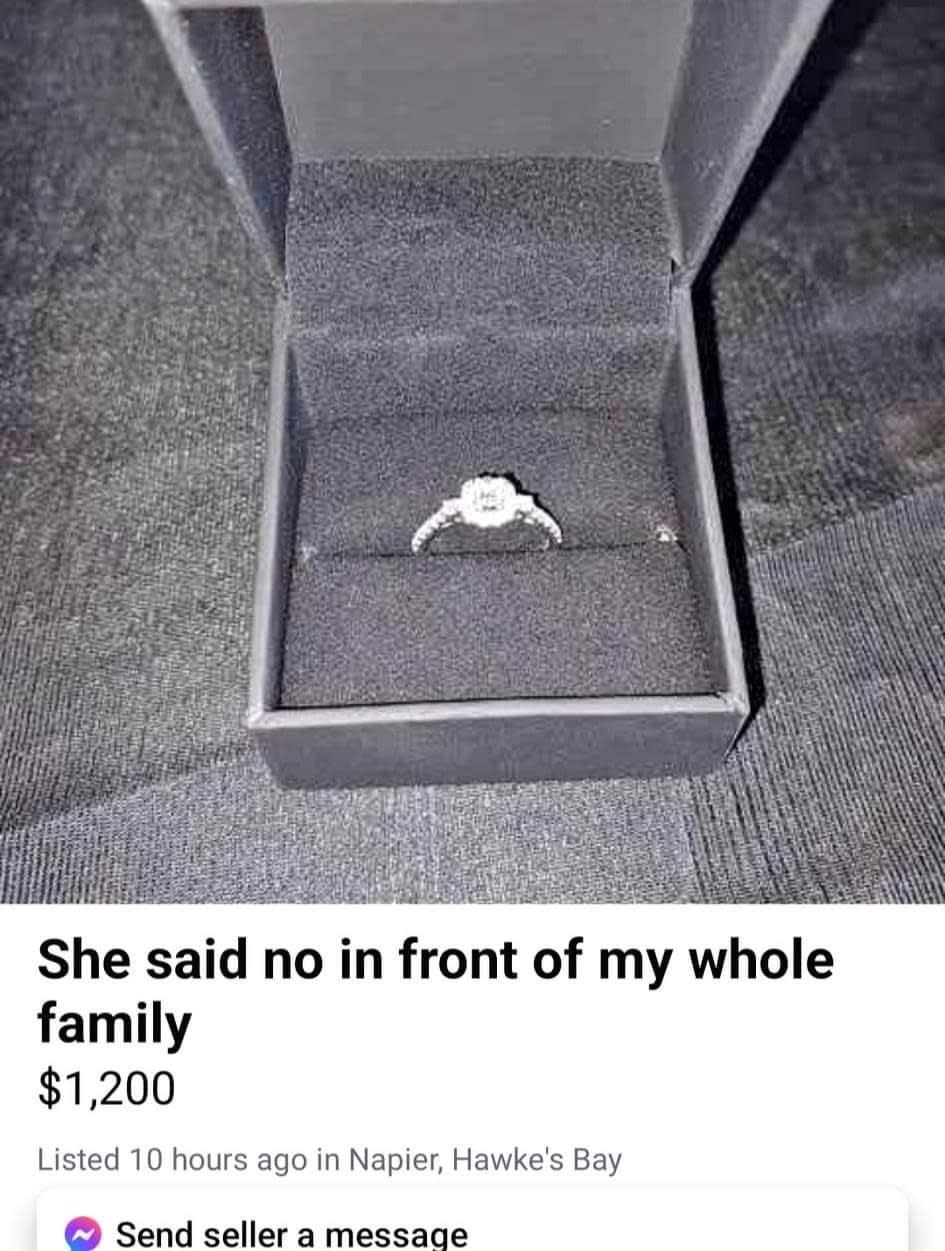 An engagement ring in a box with text: "She said no in front of my whole family. $1,200. Listed 10 hours ago in Napier, Hawke's Bay."