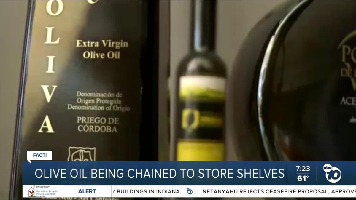 Olive oil being being chained to store shelves