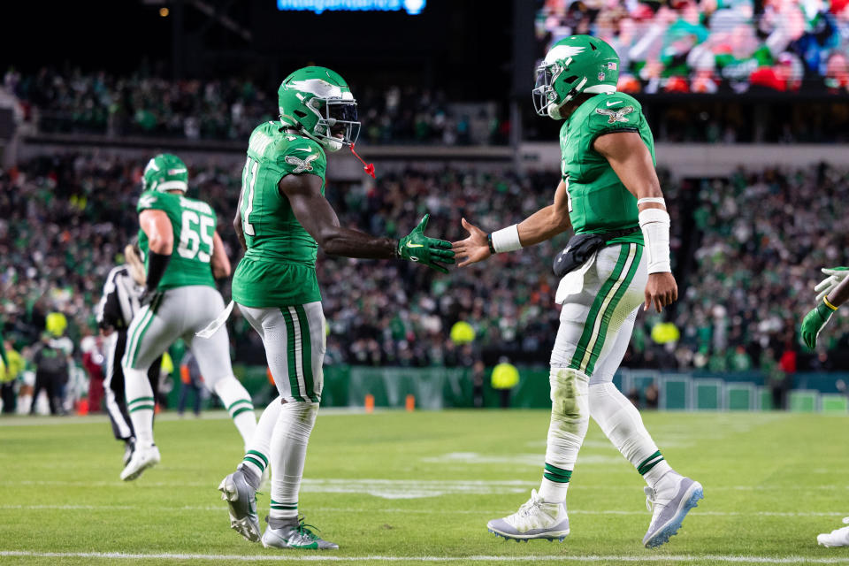 A.J. Brown (left) and Jalen Hurts are a uniquely prolific quarterback-receiver tandem in the NFL. (Bill Streicher-USA TODAY Sports)