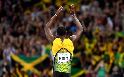 Jamaica's Usain Bolt reacts after the heats of the men's 100m - Credit: AFP