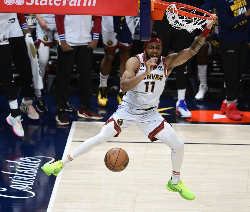 DENVER, CO - JUNE 12: Bruce Brown (11) of the Denver Nuggets slam dunks against the Miami Heat in the first half during Game 5 of the NBA Finals at Ball Arena June 12, 2023. (Photo by Andy Cross/MediaNews Group/The Denver Post via Getty Images)