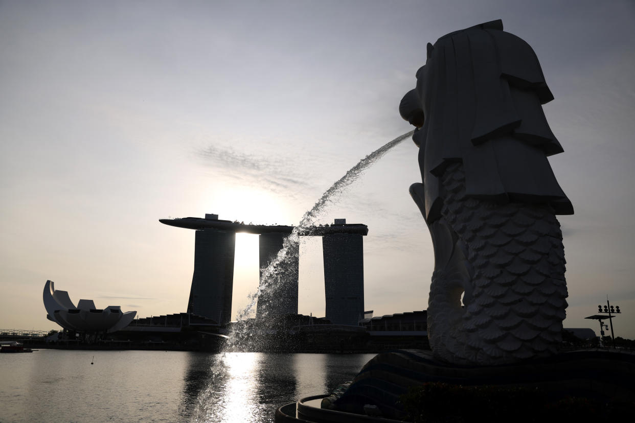 The Merlion statue and the Marina Bay Sands Hotel in Singapore, on Tuesday, Jan. 3, 2023. (Photographer: Lionel Ng/Bloomberg)