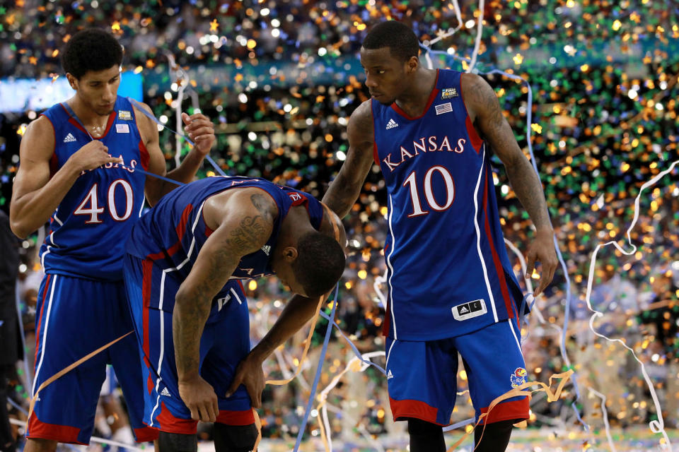 Kevin Young #40, Thomas Robinson #0 and Tyshawn Taylor #10 of the Kansas Jayhawks react after losing to the Kentucky Wildcats 67-59 in the National Championship Game of the 2012 NCAA Division I Men's Basketball Tournament at the Mercedes-Benz Superdome on April 2, 2012 in New Orleans, Louisiana. (Photo by Ronald Martinez/Getty Images)