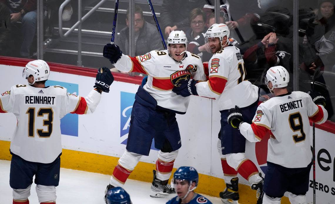 Florida Panthers left wing Matthew Tkachuk, second from left, celebrates his goal against the Colorado Avalanche with, from left, Sam Reinhart, Aleksander Barkov and Sam Bennett during the third period of an NHL hockey game Tuesday, Jan. 10, 2023, in Denver. (AP Photo/David Zalubowski)