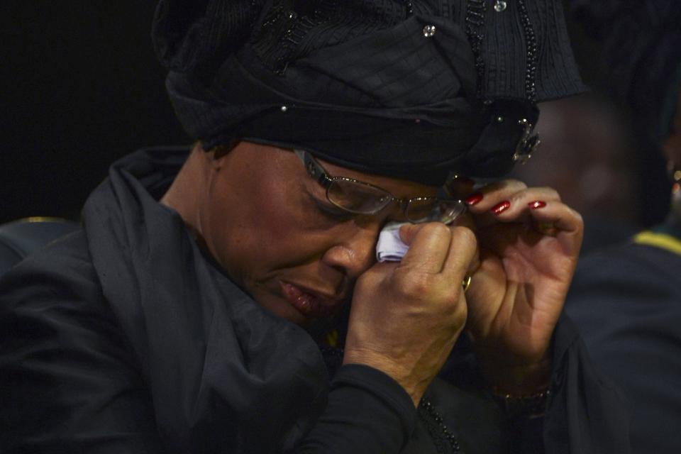 Graca wipes her tears during the funeral ceremony of Mandela in Qunu