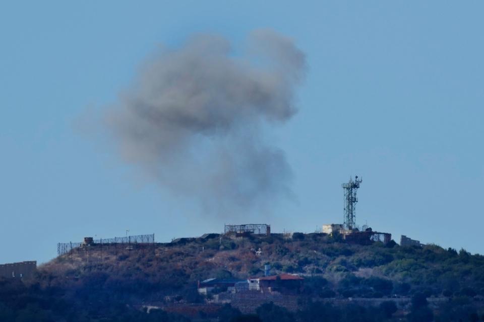 Smoke rises from an Israeli army position which was hit by Hezbollah shells as it is seen from Rmeish, a Lebanese border village (Copyright 2023 The Associated Press. All right reserved)