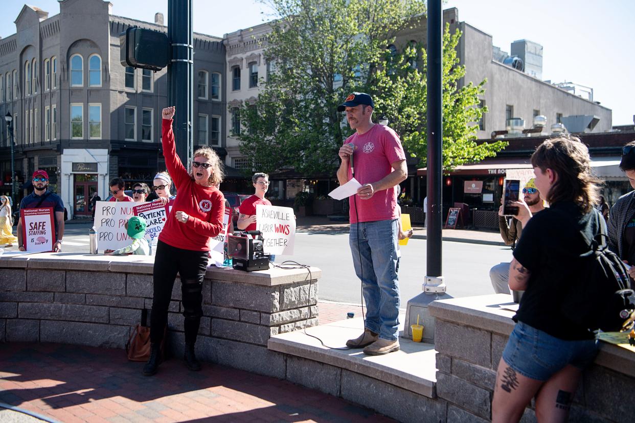 Welcker Taylor, president of the Asheville Fire Fighters Association, speaks at a May Day rally in Pack Square, May 1, 2024.