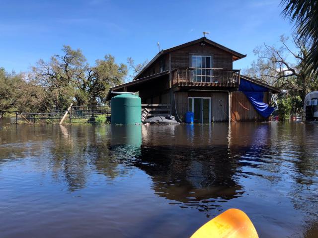 The office and barn of the non profit animal rescue Paws N Hooves FL is surrounded by water near Myakka City, Florida after Hurricane Ian's intense rainfall.
