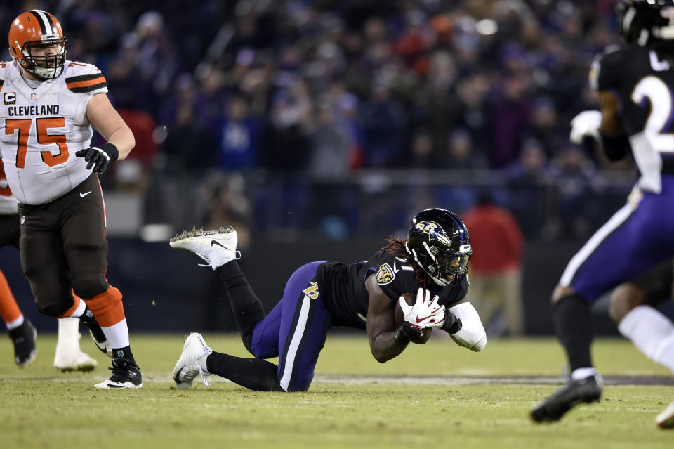 Baltimore Ravens inside linebacker C.J. Mosley, center, intercepts a pass attempt in the final moments of an NFL football game against the Cleveland Browns, Sunday, Dec. 30, 2018, in Baltimore. Baltimore won 26-24. (AP Photo/Gail Burton)