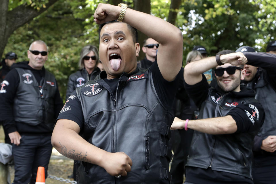 Members of the Tu Tangata motorcycle club perform a haka outside the Al Noor mosque in Christchurch, New Zealand, Sunday, March 15, 2020. A national memorial in New Zealand to commemorate the 51 people who were killed when a gunman attacked two mosques one year ago has been canceled due to fears over the new coronavirus. (AP Photo/Mark Baker)