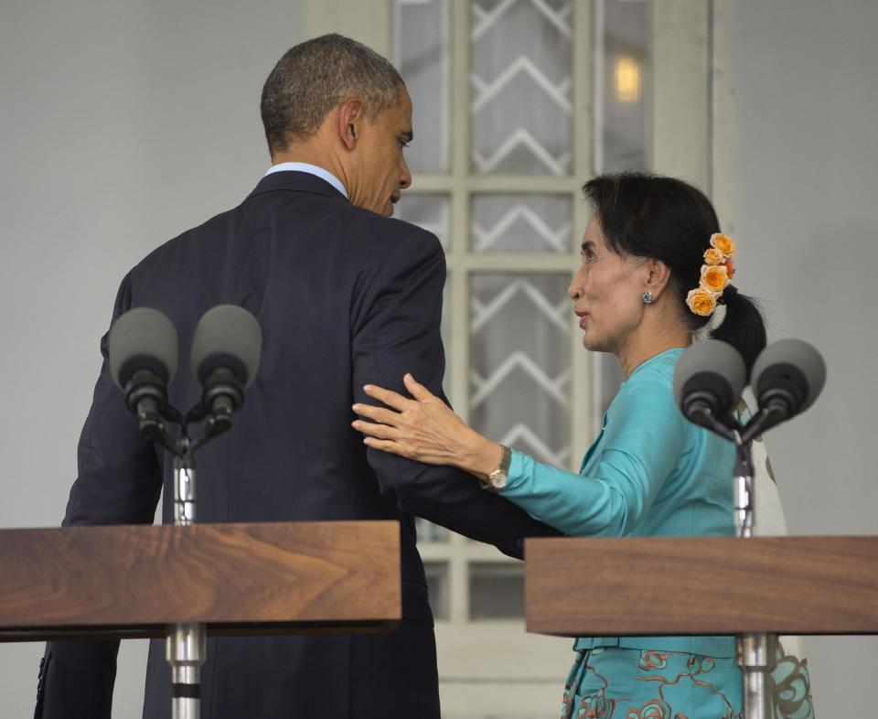 FILE - In this Nov. 14, 2014, file photo, U.S. President Barack Obama, left, with Myanmar's opposition leader Aung San Suu Kyi walks back to her home after a news conference in Yangon, Myanmar. Obama's foreign policy legacy may be defined as much by what he didn't do as what he did. (AP Photo/Pablo Martinez Monsivais, File)