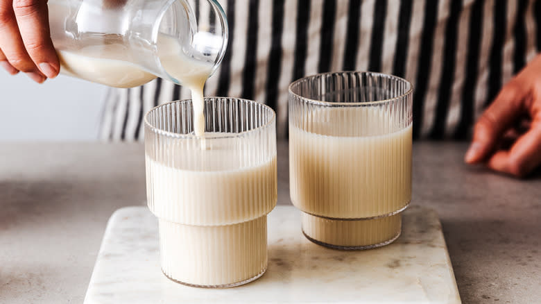 pouring glasses of milk