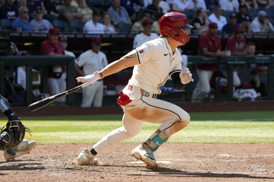 Arizona Diamondbacks' Corbin Carroll hits an RBI single against the New York Yankees in the tenth inning during a baseball game, Wednesday, April 3, 2024, in Phoenix. (AP Photo/Rick Scuteri)