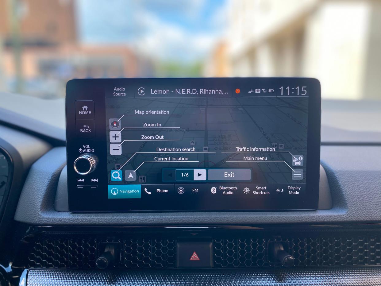 The 9-inch touchscreen atop the front dash of a 2025 Honda CR-V Hybrid showing its built-in navigation system.