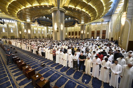 A special forces soldier stands as Sunni and Shi'ite worshippers, together with Emir Sheikh Sabah al Ahmed al Sabah, pray at the Grand Mosque of Kuwait, in Kuwait City, July 3, 2015. REUTERS/Jassim Mohammed