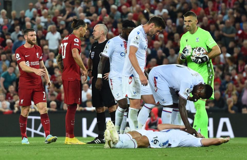 Crystal Palace’s Joachim Andersen is on the floor after sustaining an injury as Liverpool’s Darwin Nunez is sent off (Reuters)