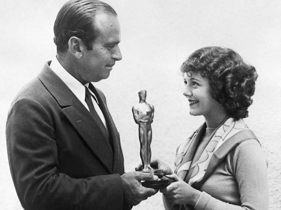 Douglas Fairbanks gives Janet Gaynor the first Academy Award for Best Actress.