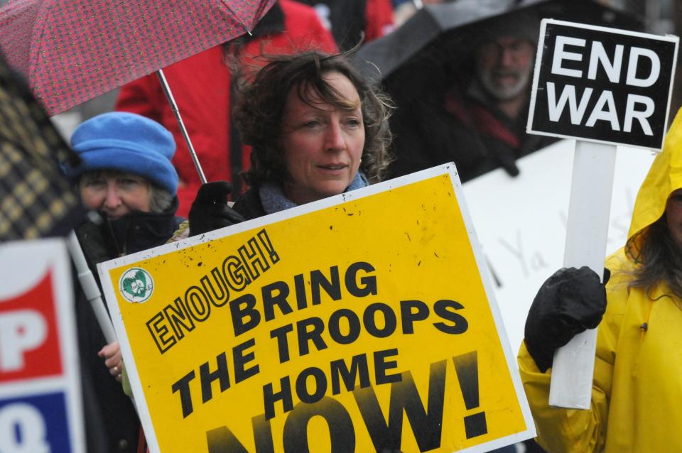 Diane Turco, center, with war protesters along Main Street Hyannis in March 2008 marching to Congressman Delahunt's office to read the names of the war dead.