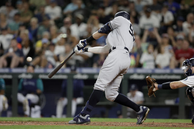 Injured New York Yankees outfielder Aaron Judge spits a seed as he watches  from the dugout during the fourth inning of a baseball game against the  Seattle Mariners, Saturday, Sept. 8, 2018