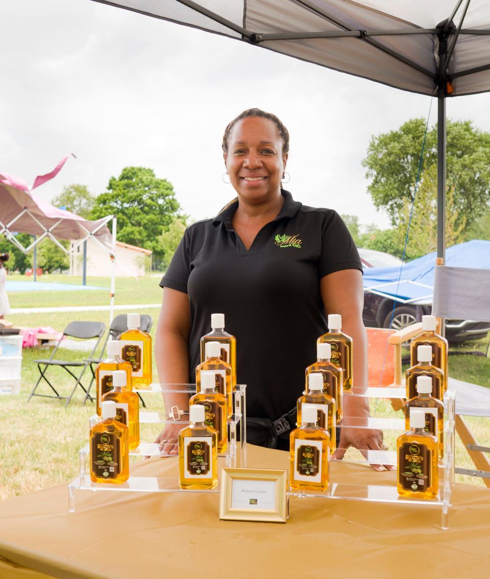 Mia Diggins attended the South Bend Juneteenth celebration at LaSalle Park on Saturday, where she displayed her assortment of natural oils for hair and skin.