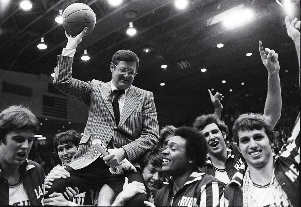 University of Kentucky basketball coach Joe B. Hall was carried off the floor after UK defeated IU 92-90 in the NCAA Mideast Regional finals in Dayton, Ohio, on March 22, 1975. UK players, from left were: Danny Hall, Rick Robey, Jimmy Dan Conner, Marion Haskins, Mike Phillips and Mike Flynn. &#x00201c;That game with Indiana was the most satisfying game, and I think the most important game in my career,&#x00201d; Hall later said.