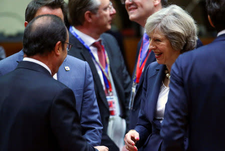 French President Francois Hollande and British Prime Minister Theresa May attend a European Union leaders summit in Brussels, Belgium October 20, 2016. REUTERS/Yves Herman