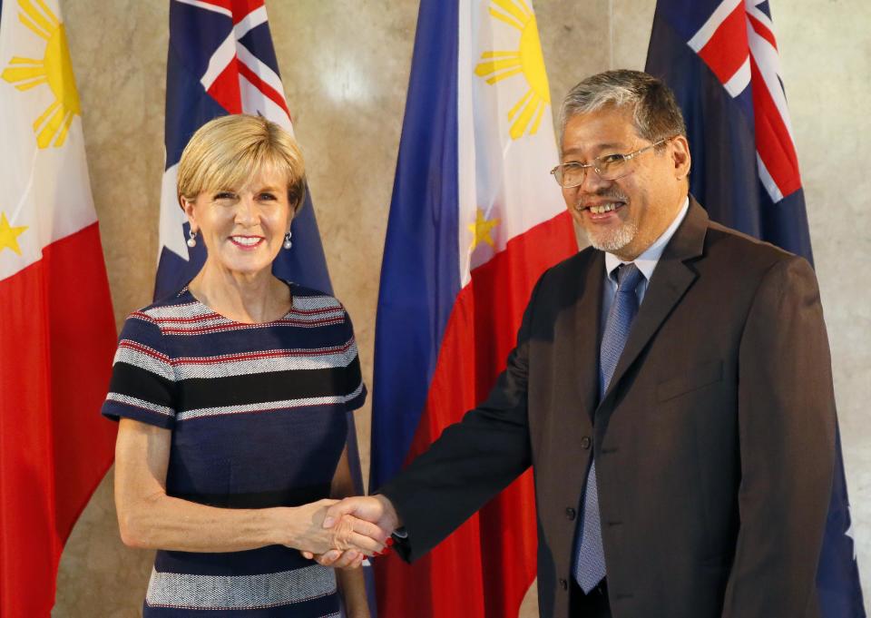 Australian Foreign Minister Julie Bishop, left, and acting Philippine Foreign Affairs Secretary Enrique Manalo shake hands prior to their meeting Thursday, March 16, 2017 in suburban Pasay city, south of Manila, Philippines. Bishop is on a two-day visit in the country to discuss bilateral relations between the two countries which includes a meeting with President Rodrigo Duterte. (AP Photo/Bullit Marquez)