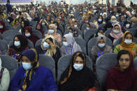 Delegates wearing a protective face masks to help curb the spread of the coronavirus attend an Afghan Loya Jirga meeting in Kabul, Afghanistan, Friday, Aug. 7, 2020. The traditional council opened Friday in the Afghan capital to decide the release of a final 400 Taliban - the last hurdle to the start of negotiations between Kabul’s political leadership and the Taliban in keeping with a peace deal the United States signed with the insurgent movement in February. (AP Photo/Rahmat Gul)