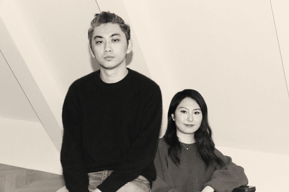 a black and white image of jw pei designers yang pei and stephanie li sitting down