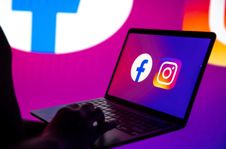 Facebook and Instagram logos on a laptop screen