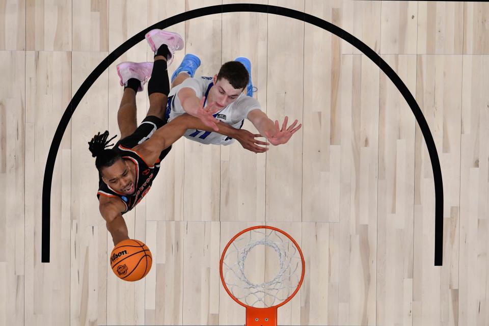 Mar 24, 2023; Louisville, KY, USA;  Princeton Tigers forward Tosan Evbuomwan (20) shoots against Creighton Bluejays center Ryan Kalkbrenner (11) during the second half at KFC YUM! Center. Mandatory Credit: Jamie Rhodes-USA TODAY Sports