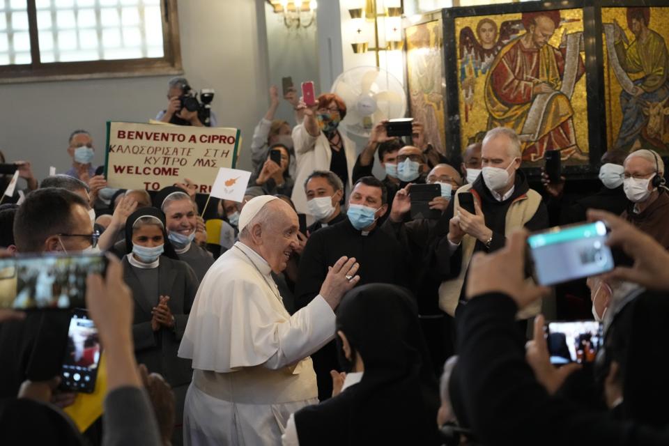 Pope Francis arrives to attend a ceremony at the Maronite Cathedral of Our Lady of Graces in Nicosia, Cyprus, Thursday, Dec. 2, 2021. Pope Francis' trip to Cyprus and Greece is drawing new attention to the plight of migrants on Europe's borders and the disconnect between Francis' Gospel-driven call for countries to welcome and integrate them and front-line governments that are increasingly unwilling or unable to let them in. (AP Photo/Alessandra Tarantino)